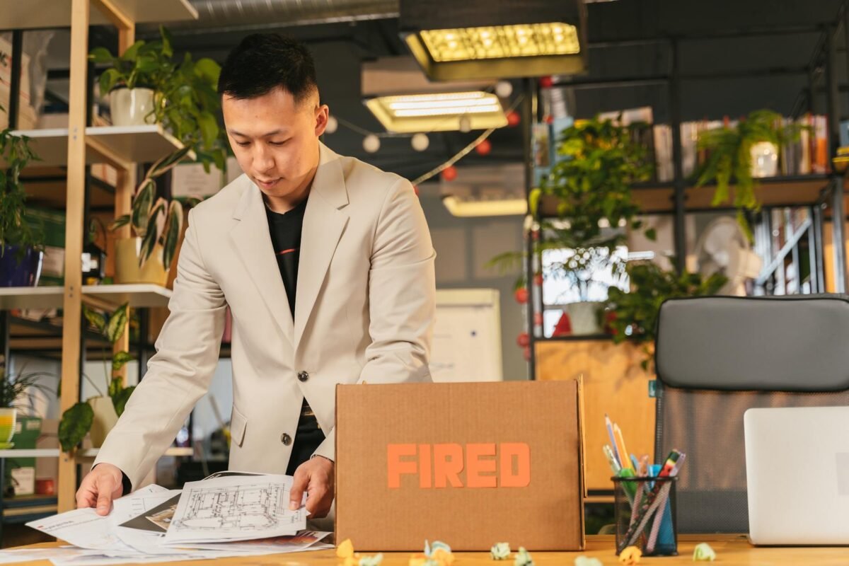 Illustration of UK worker reviewing redundancy rights documents